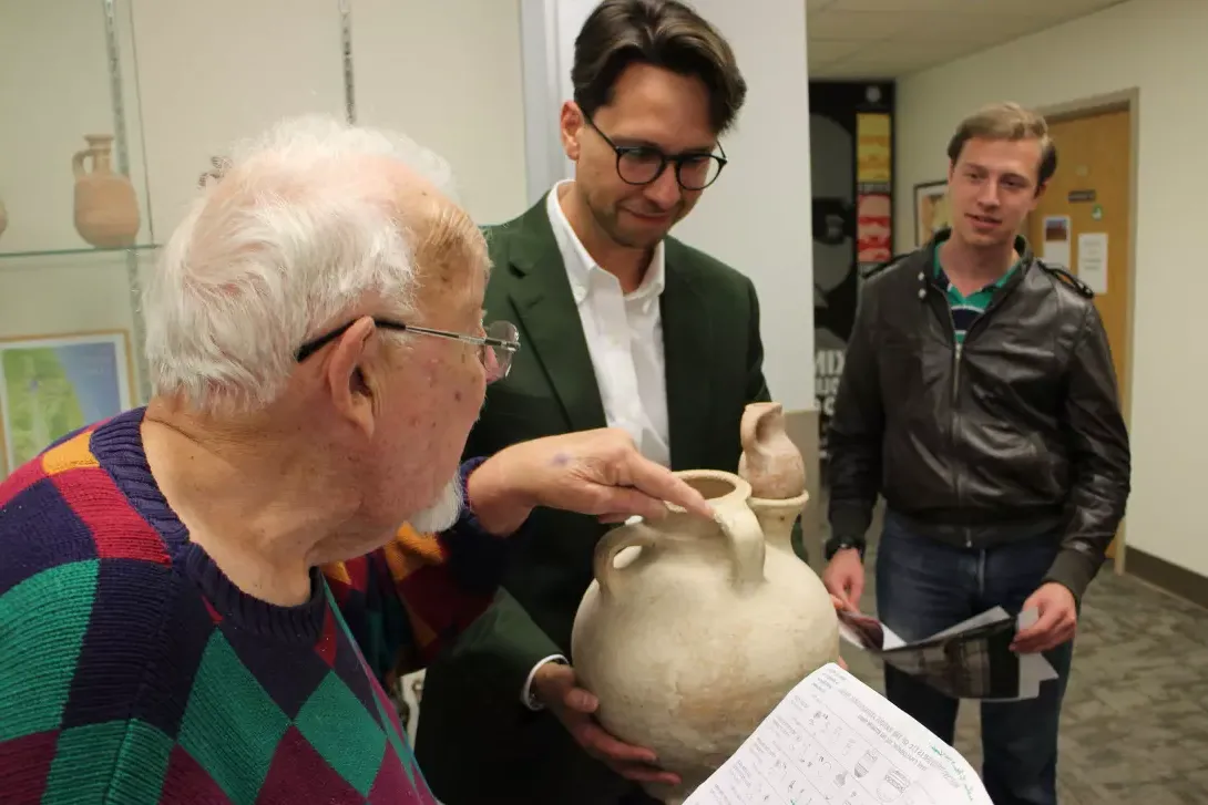 Pre-seminary students viewing artifact